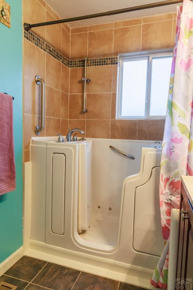 bathroom featuring a bath, curtained shower, tile patterned flooring, and vanity