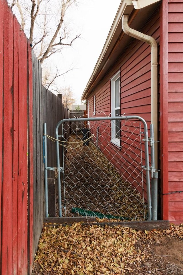 view of gate with fence