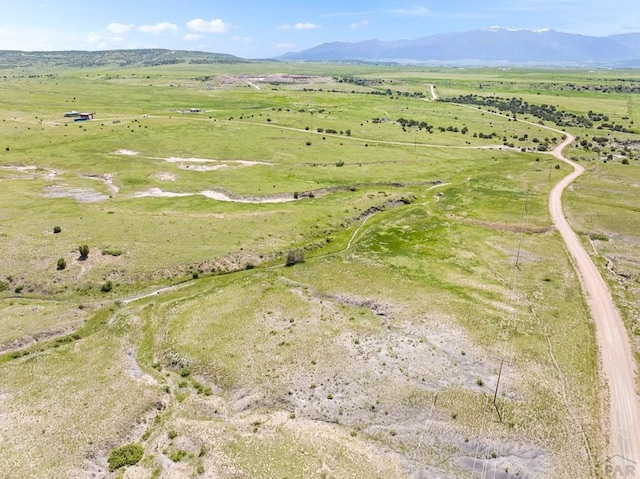 aerial view featuring a rural view and a mountain view