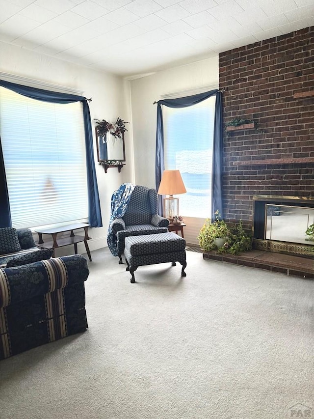 602 Belleview Ave, La Junta, CO 81050 - living area with carpet floors and a brick fireplace