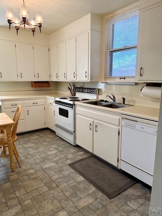 602 Belleview Ave, La Junta, CO 81050 - kitchen with white appliances, a sink, white cabinets, and light countertops
