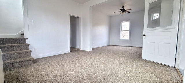 801 N Hendren Ave, Walsenburg, CO 81089 - carpeted spare room featuring stairs, ceiling fan, and baseboards