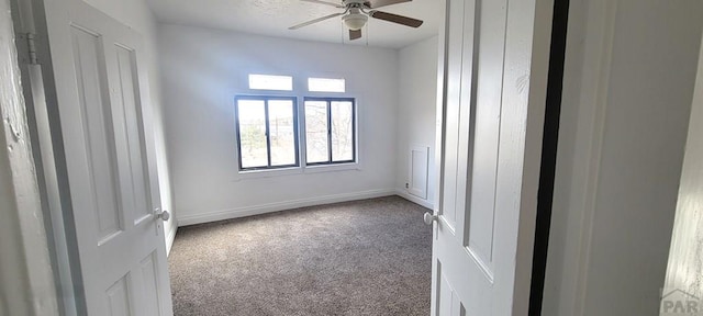 801 N Hendren Ave, Walsenburg, CO 81089 - carpeted spare room featuring a ceiling fan and baseboards
