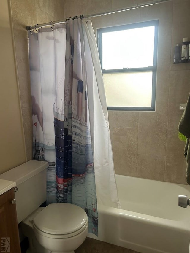 bathroom with vanity, toilet, and shower / tub combo
