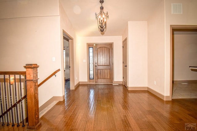 5707 Mark Twain Ln, Pueblo, CO 81008 - foyer entrance with hardwood / wood-style flooring and a chandelier
