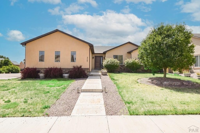 5707 Mark Twain Ln, Pueblo, CO 81008 - view of front of house with a front yard and stucco siding