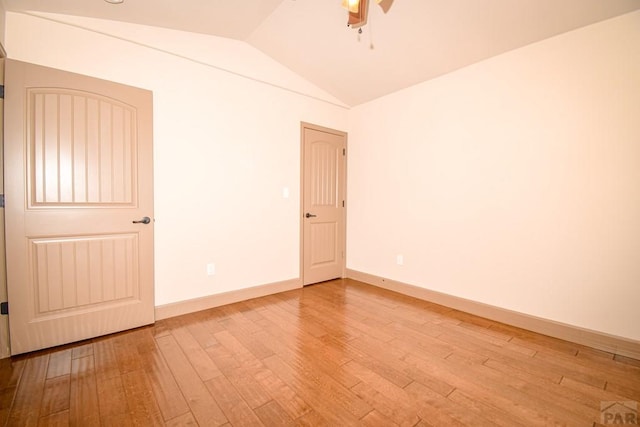 5707 Mark Twain Ln, Pueblo, CO 81008 - spare room featuring hardwood / wood-style flooring, vaulted ceiling, and a ceiling fan