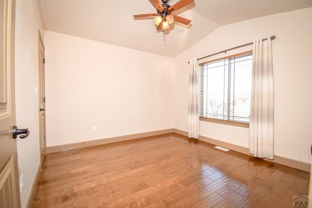 5707 Mark Twain Ln, Pueblo, CO 81008 - unfurnished room featuring hardwood / wood-style flooring, vaulted ceiling, and a ceiling fan