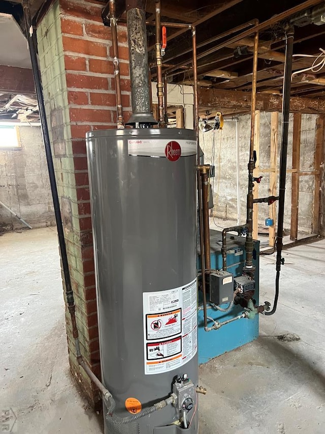 utility room featuring water heater