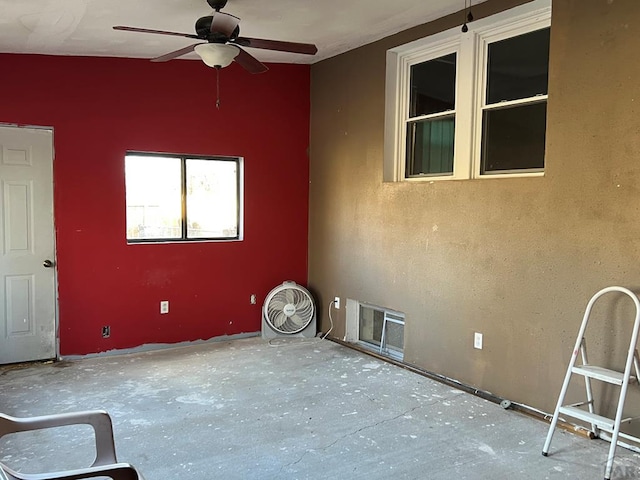 spare room featuring visible vents and a ceiling fan