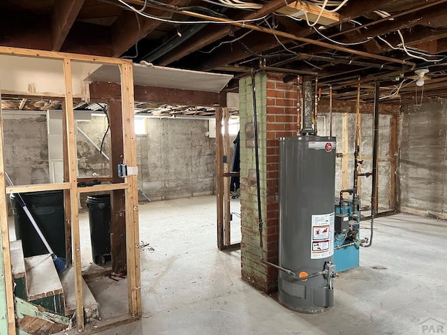 unfinished basement featuring gas water heater