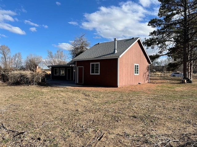 view of property exterior with a patio area