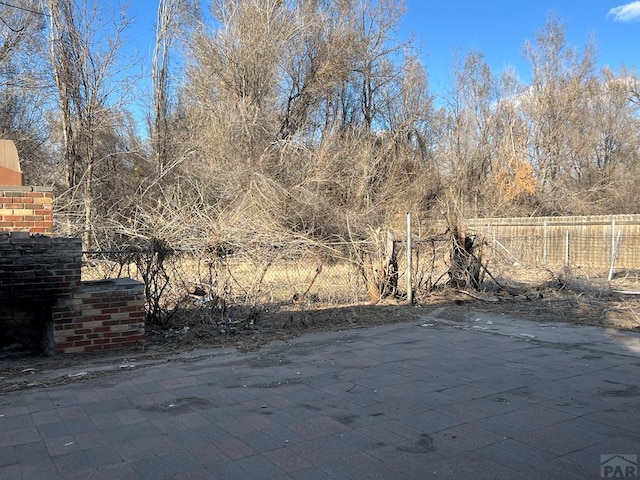 exterior space featuring a patio area and fence