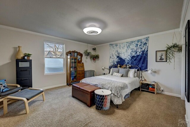 bedroom with baseboards, carpet, and crown molding