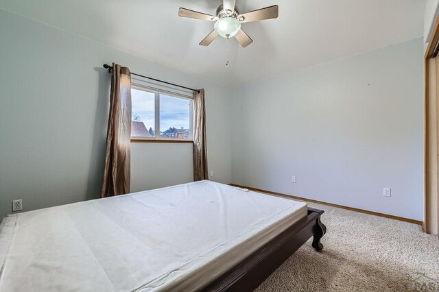 bedroom with carpet, baseboards, and ceiling fan