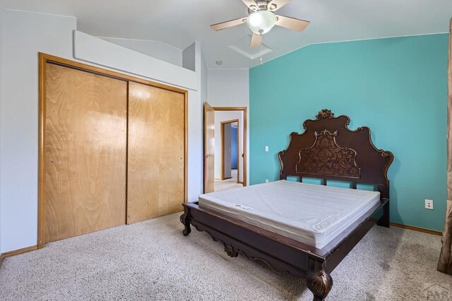 carpeted bedroom with lofted ceiling, a closet, billiards, and baseboards