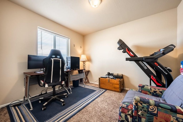 carpeted home office with baseboards