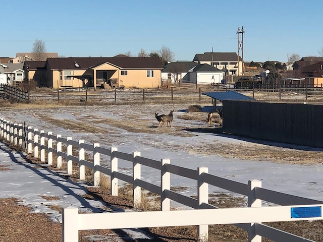 view of yard with a residential view and fence