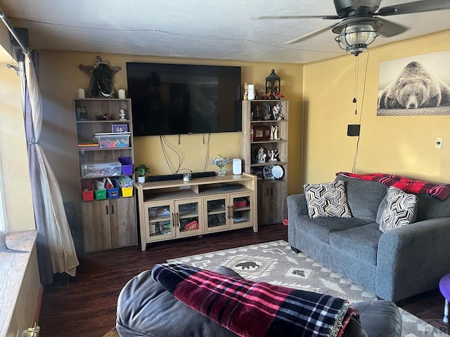 living room with wood finished floors and ceiling fan