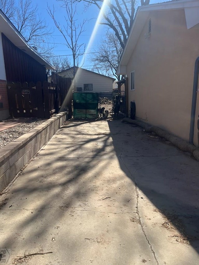 exterior space featuring fence and stucco siding