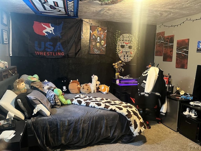 carpeted bedroom featuring a textured ceiling