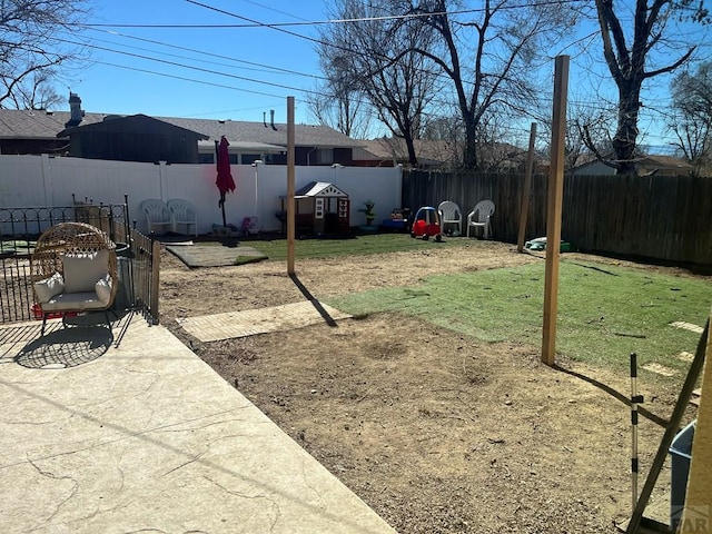 view of yard with a fenced backyard