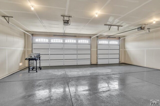 garage featuring a garage door opener