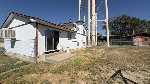 back of house featuring fence