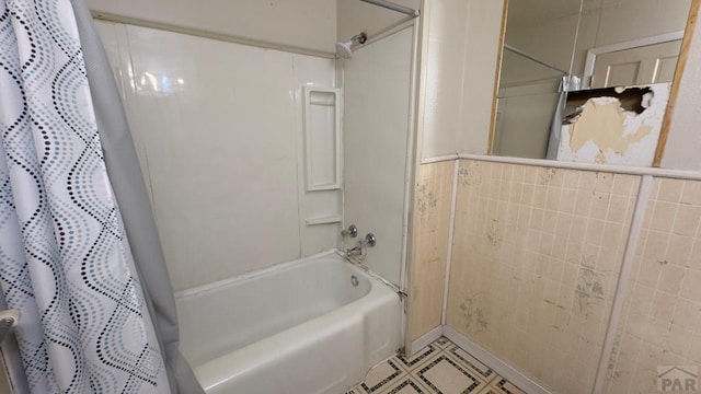 bathroom featuring shower / bath combo and tile patterned flooring