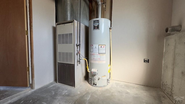 utility room with gas water heater