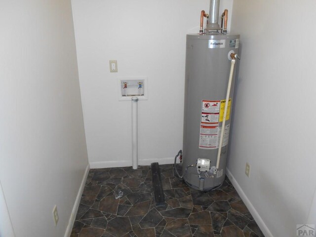 utility room featuring gas water heater