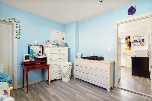 1908 E 5th St, Pueblo, CO 81001 - bedroom with light wood-style flooring