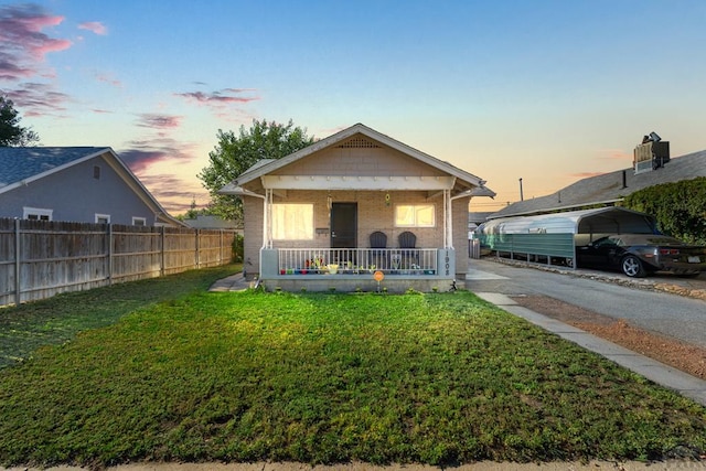 1908 E 5th St, Pueblo, CO 81001 - view of front of house featuring covered porch and brick siding