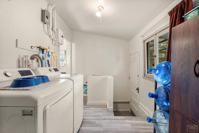 1908 E 5th St, Pueblo, CO 81001 - washroom featuring light wood finished floors, washing machine and dryer, and baseboards