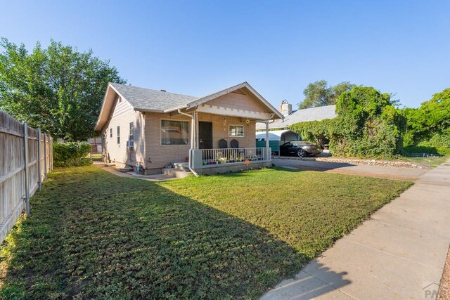 1908 E 5th St, Pueblo, CO 81001 - bungalow with a porch and brick siding