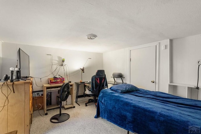 1908 E 5th St, Pueblo, CO 81001 - bedroom featuring a textured ceiling and carpet floors