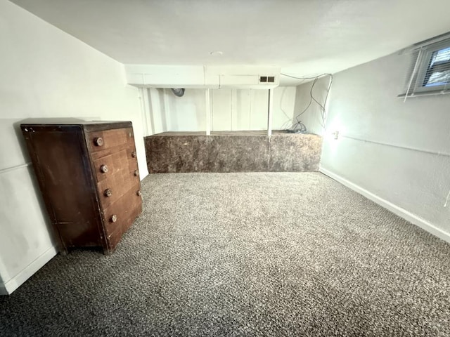 interior space with carpet, visible vents, and baseboards