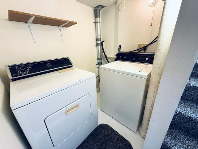 laundry room with washer and dryer and laundry area