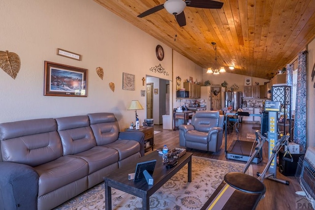 living room featuring lofted ceiling, ceiling fan with notable chandelier, wood finished floors, and wood ceiling