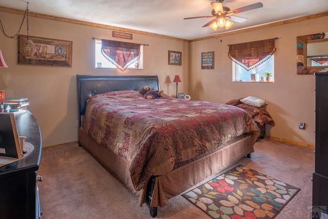 carpeted bedroom featuring ornamental molding and baseboards