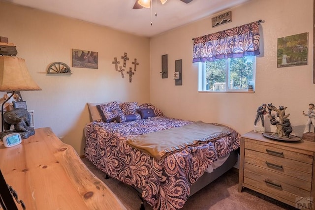 bedroom with a ceiling fan and carpet flooring