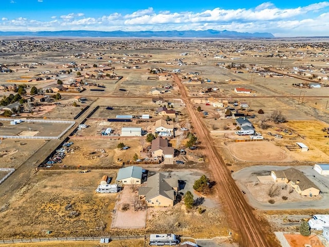 bird's eye view featuring a desert view and a mountain view