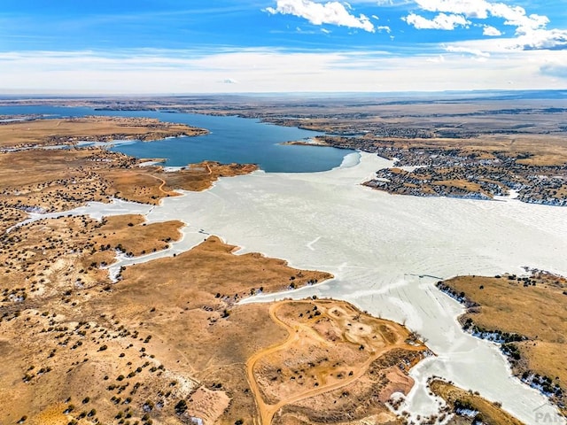 drone / aerial view with a water view