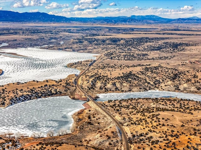 drone / aerial view featuring a mountain view