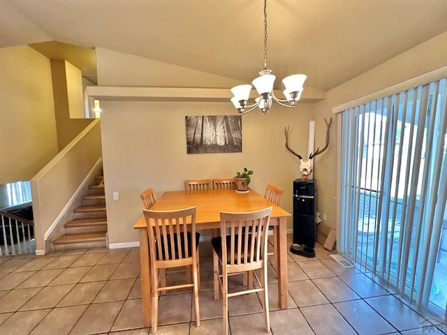 dining area with light tile patterned floors, a notable chandelier, baseboards, vaulted ceiling, and stairs