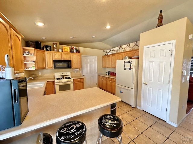 kitchen with open shelves, light countertops, a sink, white appliances, and a peninsula