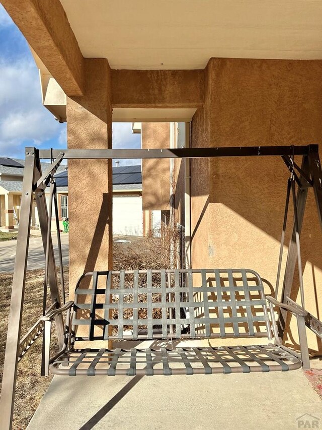 entrance to property featuring stucco siding