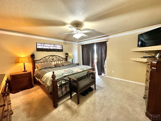 bedroom featuring light carpet, baseboards, ceiling fan, ornamental molding, and a textured ceiling