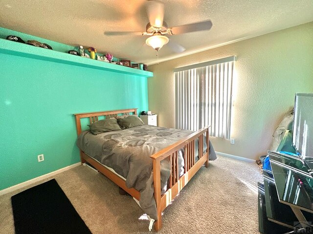 bedroom featuring a textured ceiling, a textured wall, light carpet, and baseboards