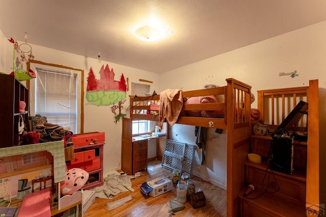 bedroom featuring light wood finished floors